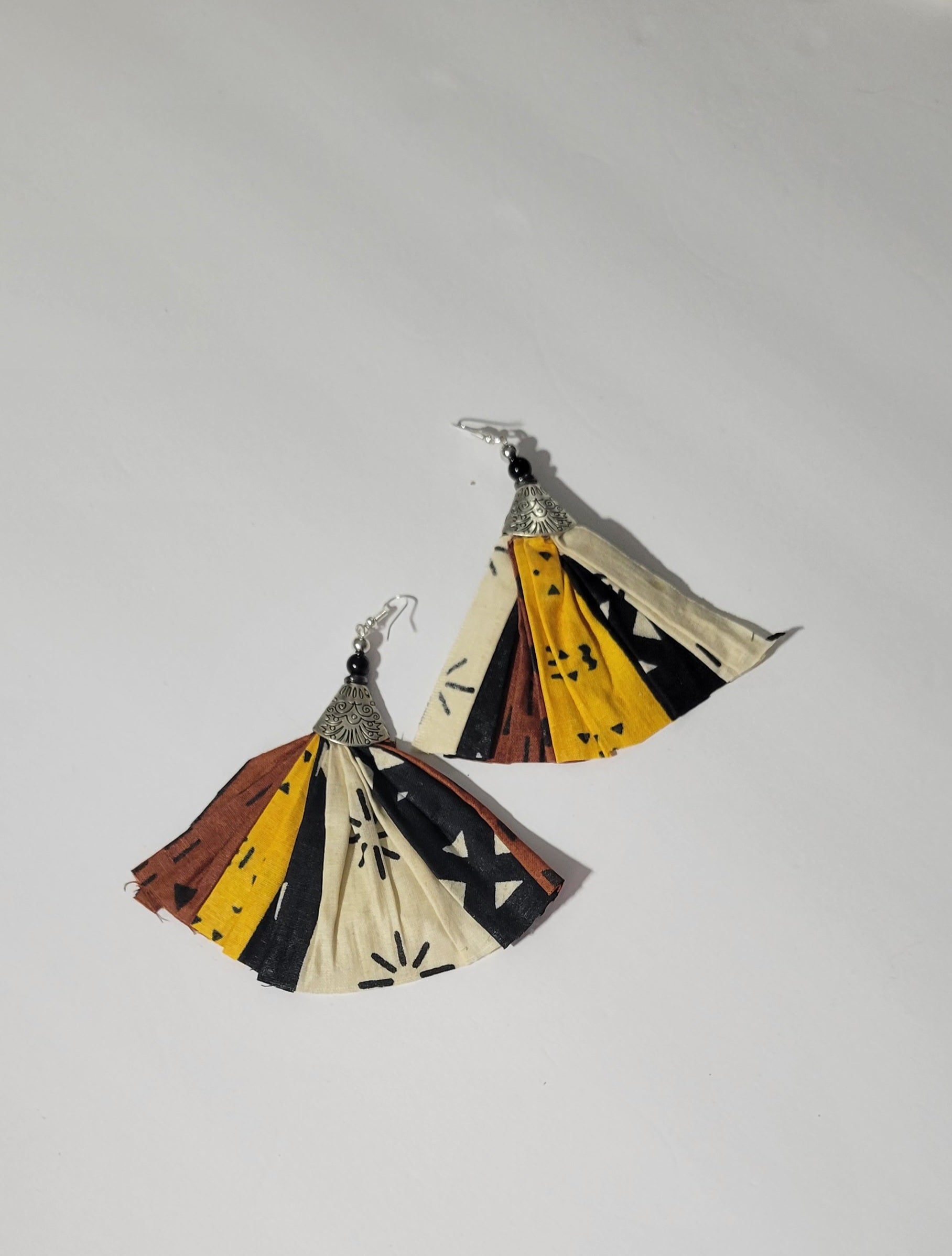 Afro-Chic handmade earrings featuring vibrant cotton fabric in black, yellow, and red, celebrating Black culture designs.
