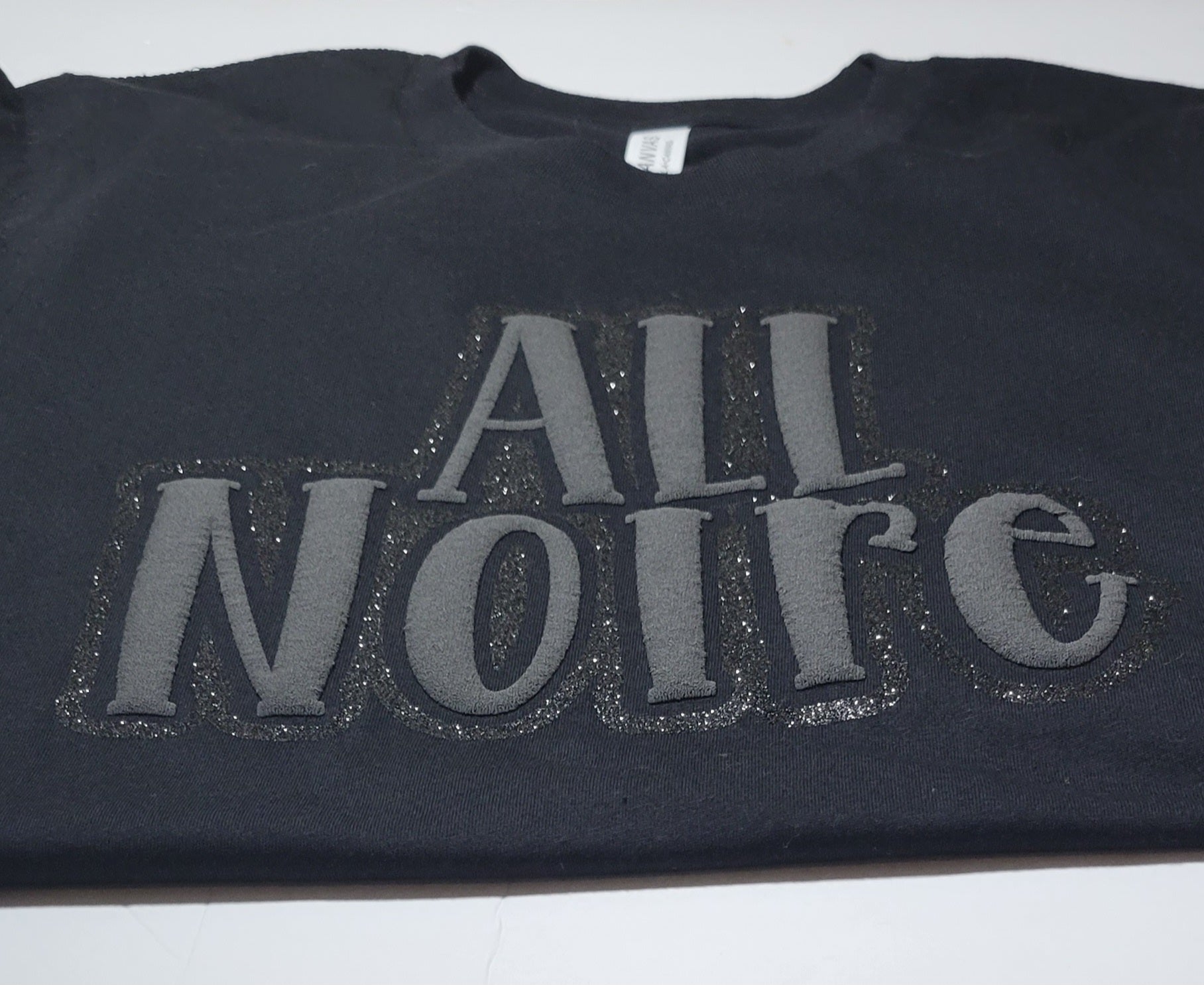 ALL Noire black cotton shirt featuring designs that resonate with Black culture.