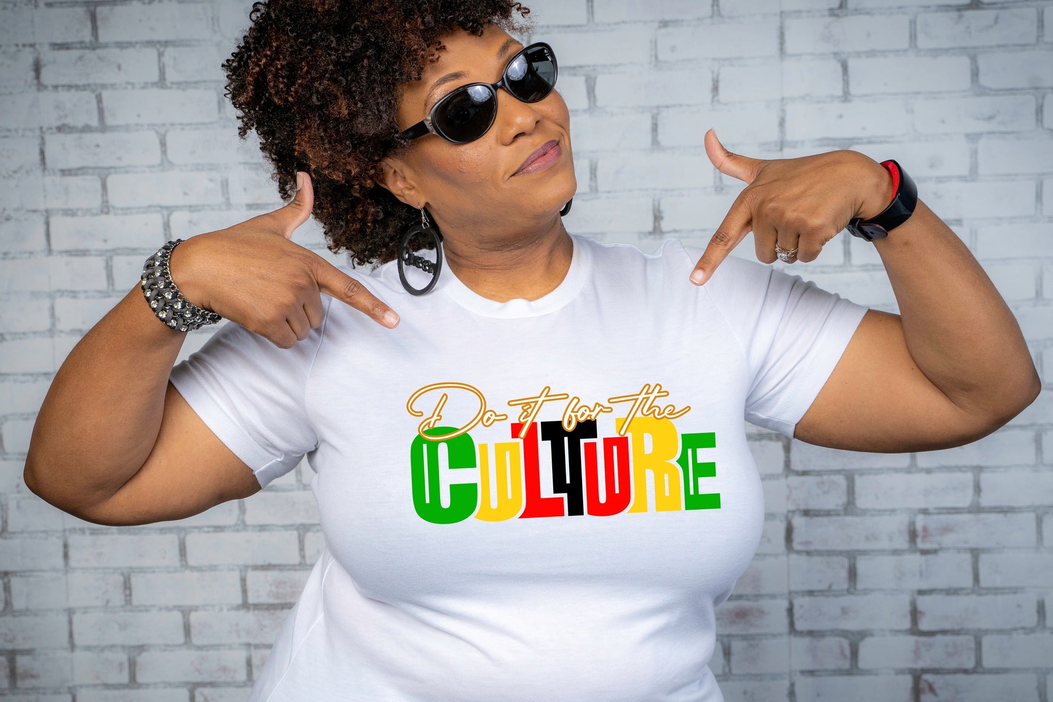 Woman wearing a white cotton shirt with 'Do it for the Culture' design, celebrating Black culture and style.